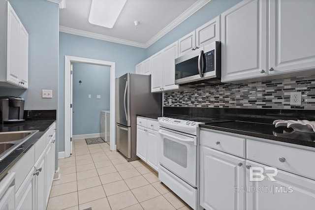 kitchen featuring white cabinetry, tasteful backsplash, ornamental molding, and stainless steel appliances