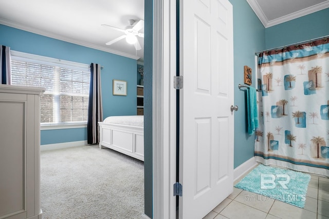 bathroom featuring baseboards, a shower with shower curtain, ceiling fan, ornamental molding, and tile patterned floors