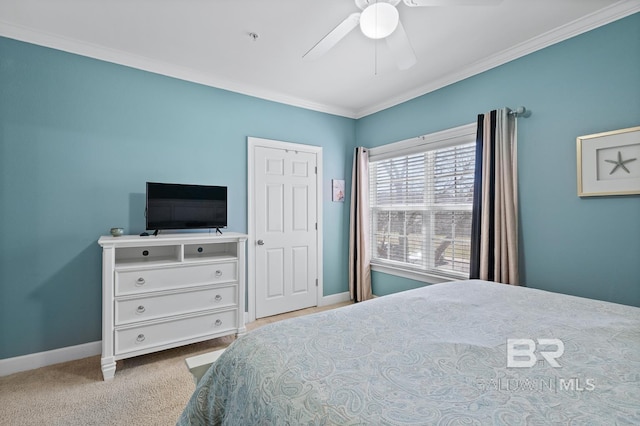 bedroom with a ceiling fan, baseboards, carpet flooring, and ornamental molding