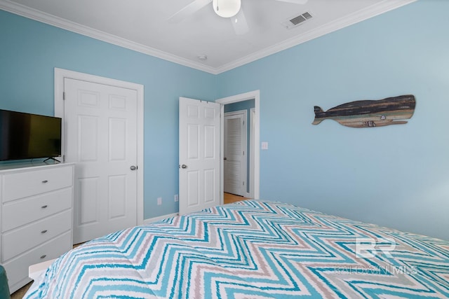 bedroom featuring ceiling fan, visible vents, and crown molding