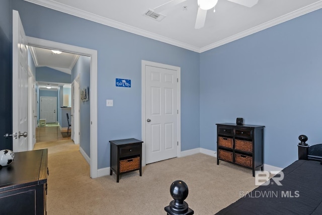 carpeted bedroom featuring ornamental molding, visible vents, baseboards, and a ceiling fan