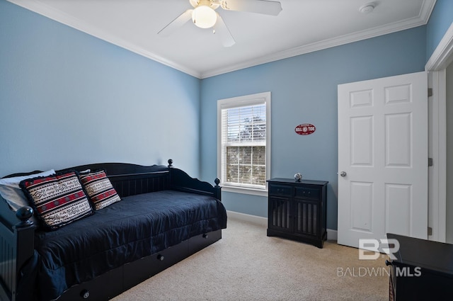 bedroom with ornamental molding, light carpet, ceiling fan, and baseboards