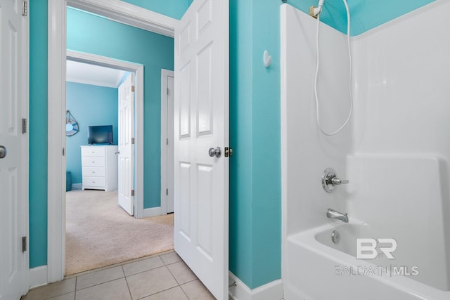 bathroom with shower / bathtub combination, baseboards, crown molding, and tile patterned floors