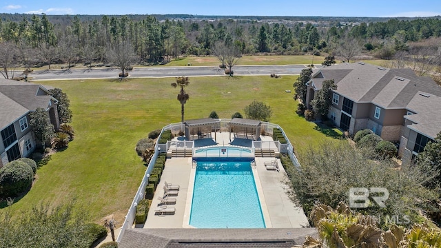 community pool featuring a yard