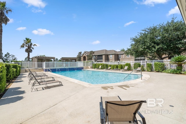 community pool featuring a patio, fence, and a pergola