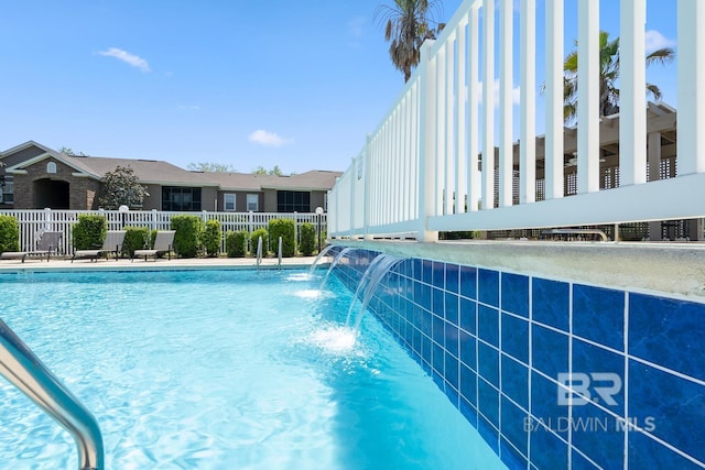 pool featuring fence