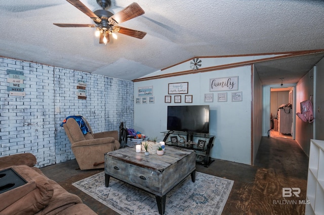 living room with ceiling fan, brick wall, a textured ceiling, vaulted ceiling, and dark hardwood / wood-style flooring