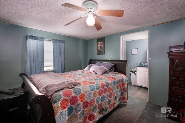 bedroom with ceiling fan, a textured ceiling, and dark wood-type flooring