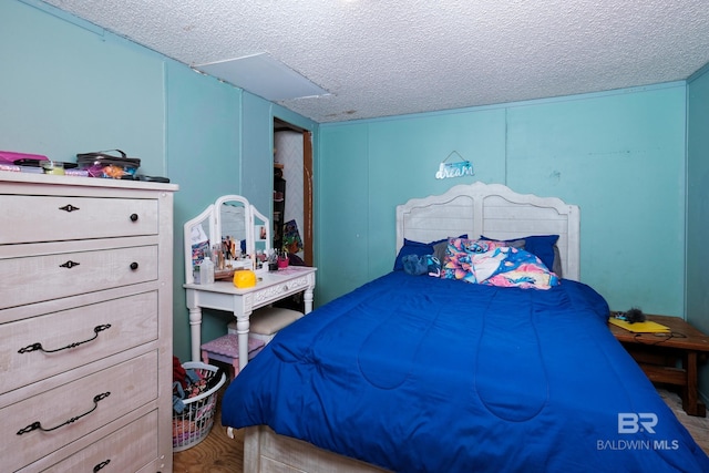 bedroom featuring a textured ceiling