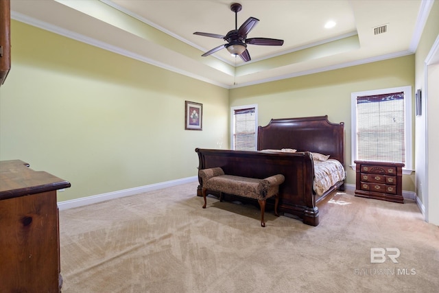 bedroom featuring baseboards, ornamental molding, carpet, and a raised ceiling