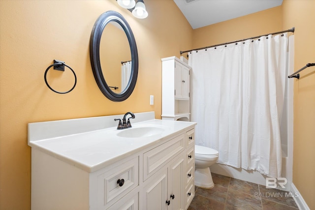 full bathroom featuring shower / tub combo, toilet, and vanity
