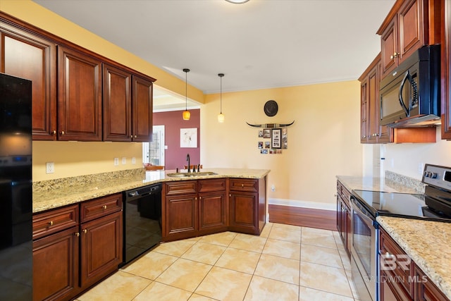 kitchen with light tile patterned flooring, a peninsula, a sink, pendant lighting, and black appliances