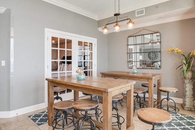 dining room featuring visible vents, ornamental molding, french doors, tile patterned flooring, and baseboards