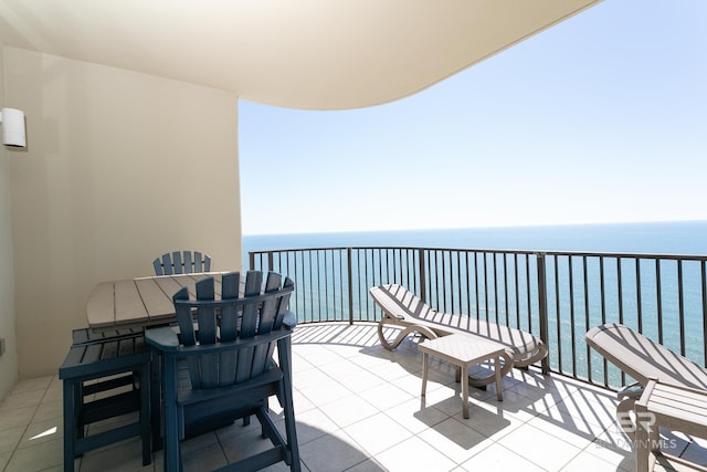 balcony featuring a water view