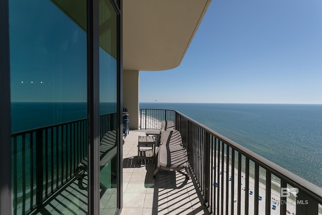 balcony featuring a water view