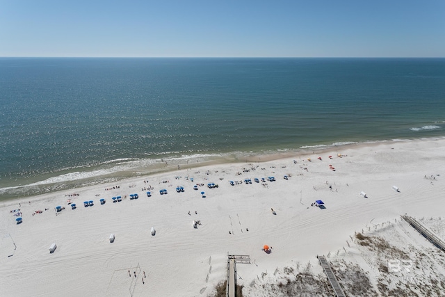 birds eye view of property featuring a view of the beach and a water view