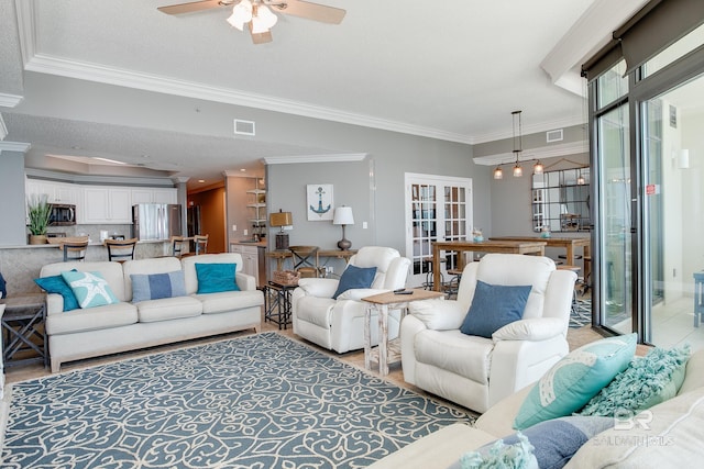 living room with visible vents, french doors, crown molding, and ceiling fan