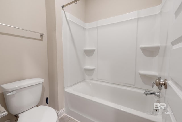 bathroom with shower / washtub combination, tile patterned flooring, and toilet