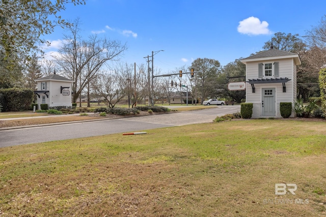 view of road with sidewalks and curbs