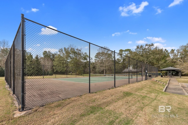 view of sport court featuring fence and a gazebo