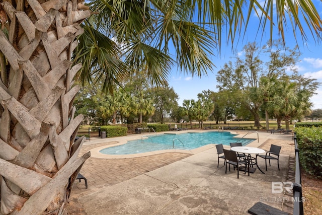 community pool with a patio