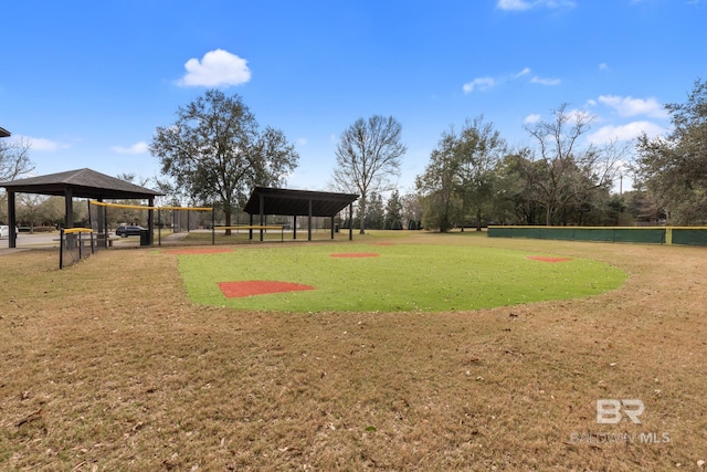 surrounding community featuring a lawn, a gazebo, and fence