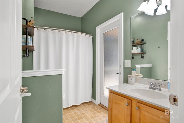 bathroom featuring vanity and a textured ceiling