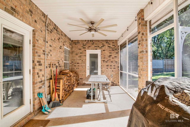 sunroom / solarium with ceiling fan