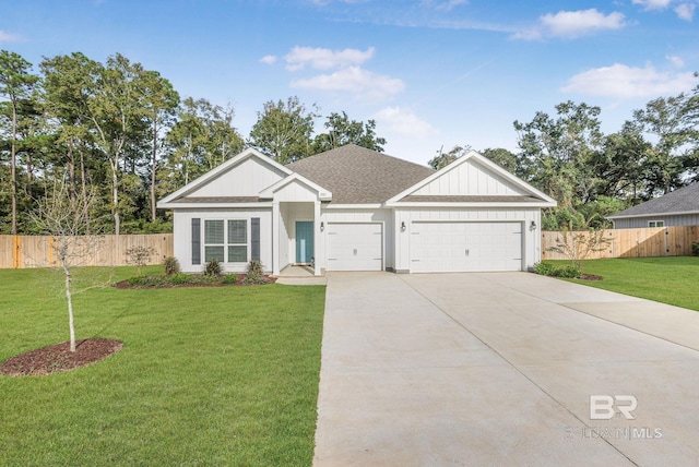 view of front of house with an attached garage, driveway, and a shingled roof