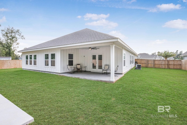 back of house with french doors, a ceiling fan, board and batten siding, roof with shingles, and a patio area