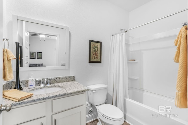 bathroom with vanity, toilet, shower / bath combination with curtain, and ceiling fan