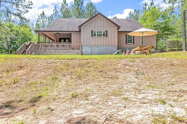 exterior space with ceiling fan and a wooden deck