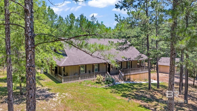 view of front of property with a front yard and a porch