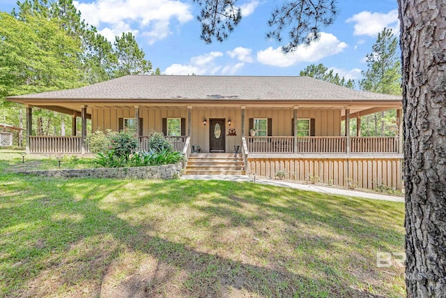 view of front facade featuring covered porch and a front yard