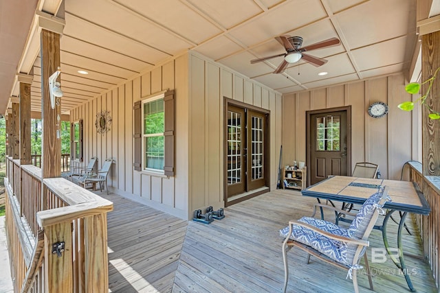 wooden deck featuring ceiling fan