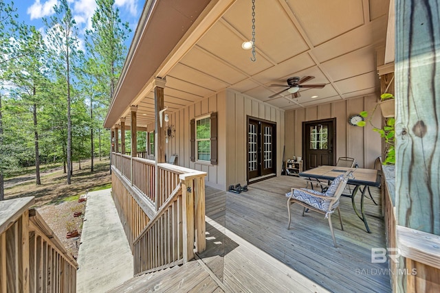 wooden terrace featuring ceiling fan