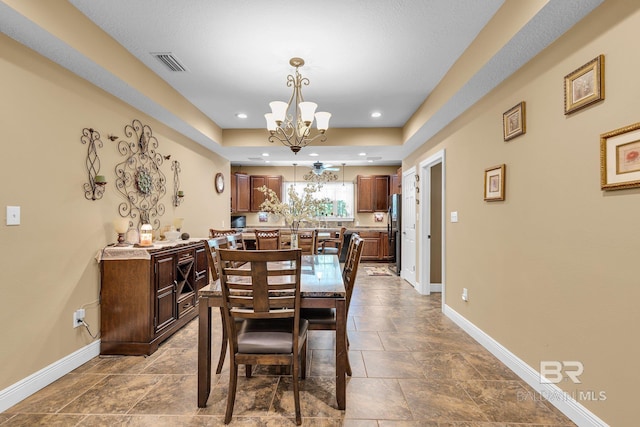 dining area featuring an inviting chandelier