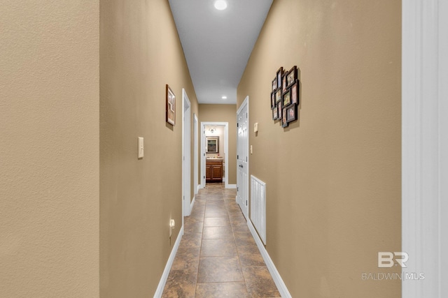 hall featuring tile patterned flooring