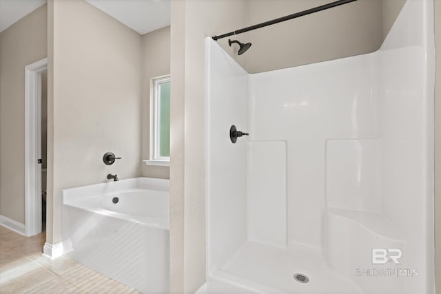 bathroom with tile patterned floors, independent shower and bath, and toilet