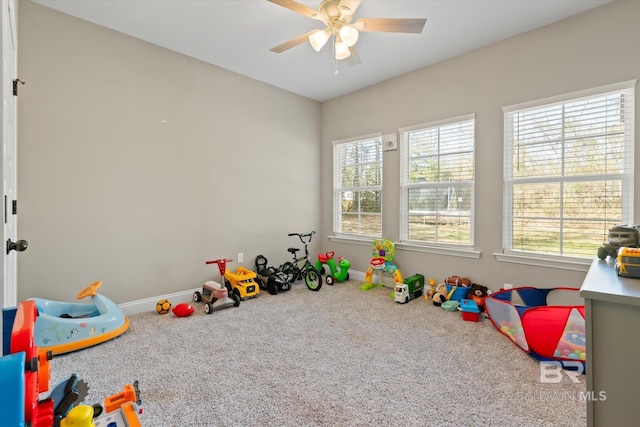 recreation room featuring carpet and ceiling fan