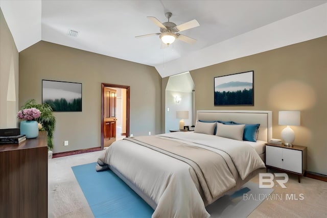 bedroom featuring lofted ceiling, baseboards, light carpet, and visible vents