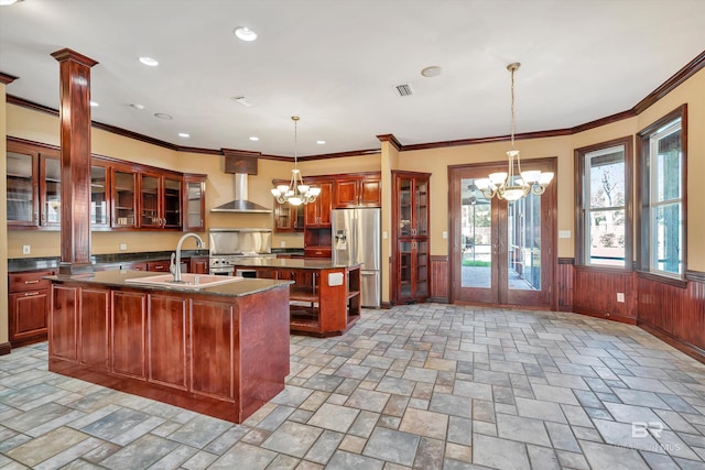 kitchen featuring glass insert cabinets, dark countertops, and stainless steel refrigerator with ice dispenser