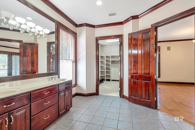 bathroom featuring ornamental molding, plenty of natural light, and tile patterned floors