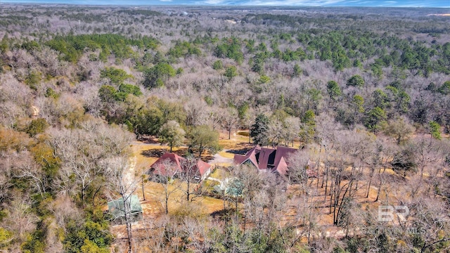 bird's eye view featuring a wooded view