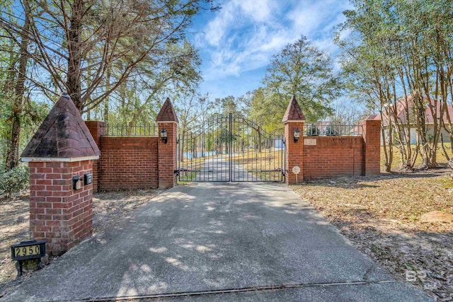 view of gate featuring fence