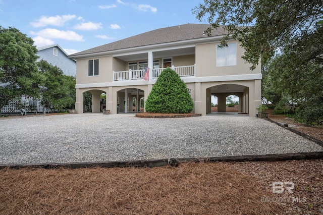 view of front of property with a balcony