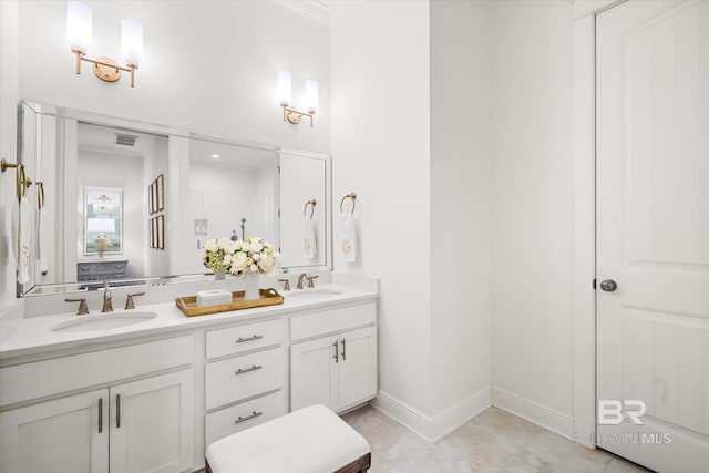 bathroom featuring tile patterned floors, crown molding, a shower with door, and vanity