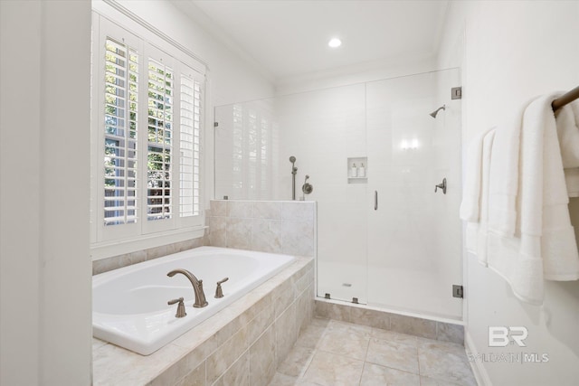 bathroom featuring shower with separate bathtub, tile patterned floors, and ornamental molding