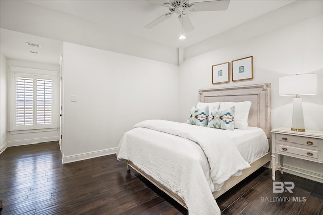 bedroom featuring ceiling fan and dark hardwood / wood-style floors