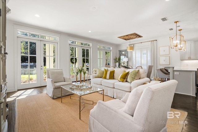 living room featuring french doors, dark hardwood / wood-style floors, and crown molding